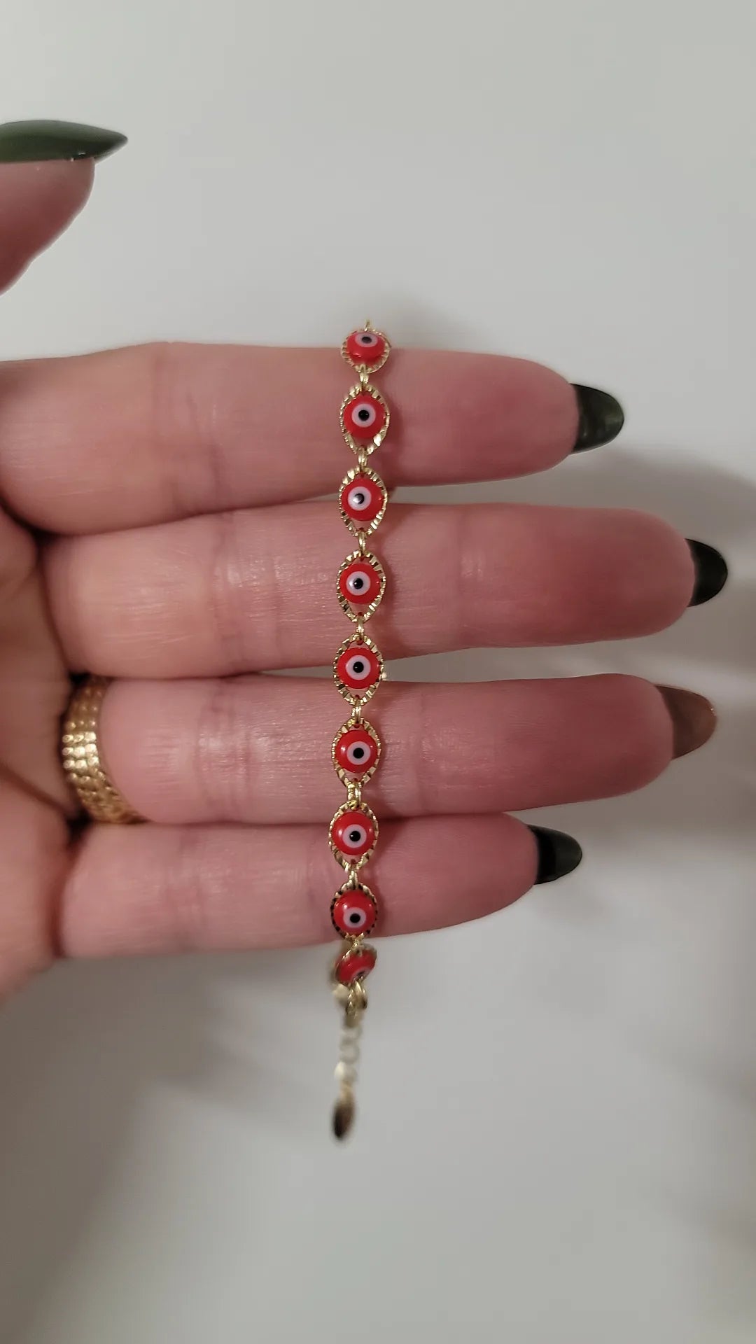 PULSERA DE OJITOS ROJOS